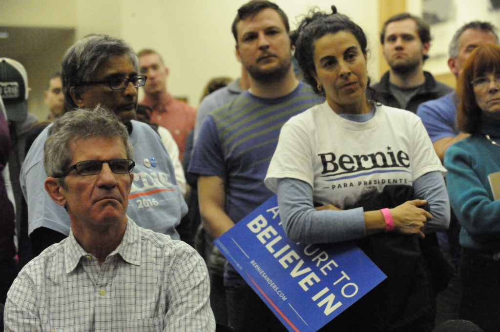 Voters line up for the Democratic presidential caucus on Super Tuesday at North High School in Denver