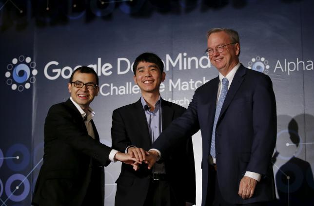 Demis Hassabis the CEO of Deep Mind Technologies and developer of AlphaGO South Korea's Lee Sedol the world's top Go player and Eric Schmidt Executive Chairman of Alphabet pose for