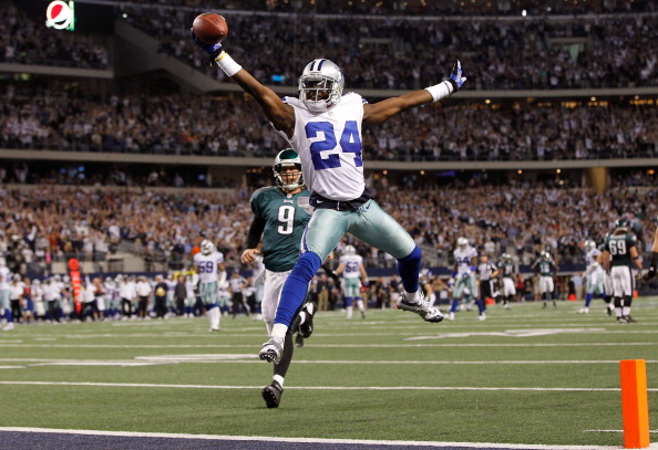 ARLINGTON TX- DECEMBER 02 Cornerback Morris Claiborne #24 of the Dallas Cowboys celebrates while crossing the goal line to score on a fumble recovery as quarterback Nick Foles #9 of the Philadelphia Eagles looks on at Cowboys Stadium