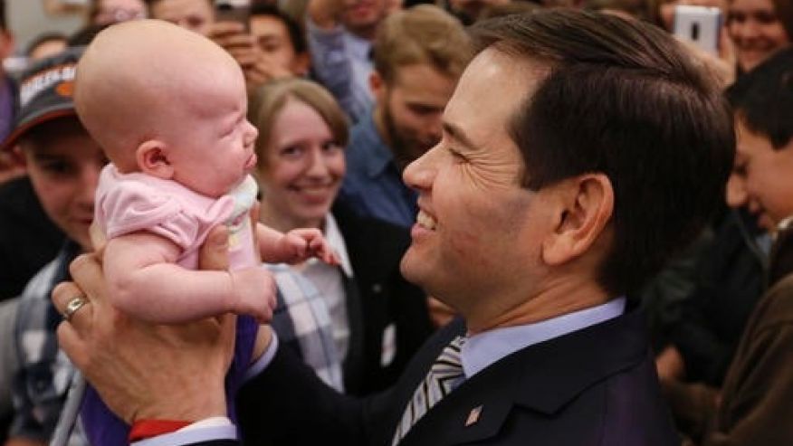 Republican presidential candidate Sen. Marco Rubio R-Fla. holds up 3-month-old Evelyn Bernard at a campaign rally in Idaho Falls Idaho Sunday