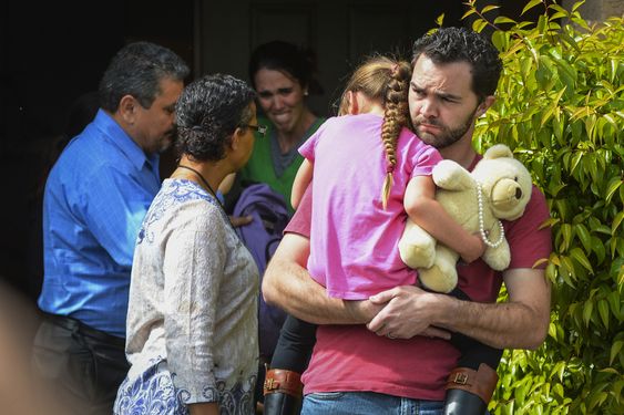 Lexi while Summer Page in the background cries as members of family services left arrive to take Lexi away from her foster family in Santa Clarita Calif. Monday