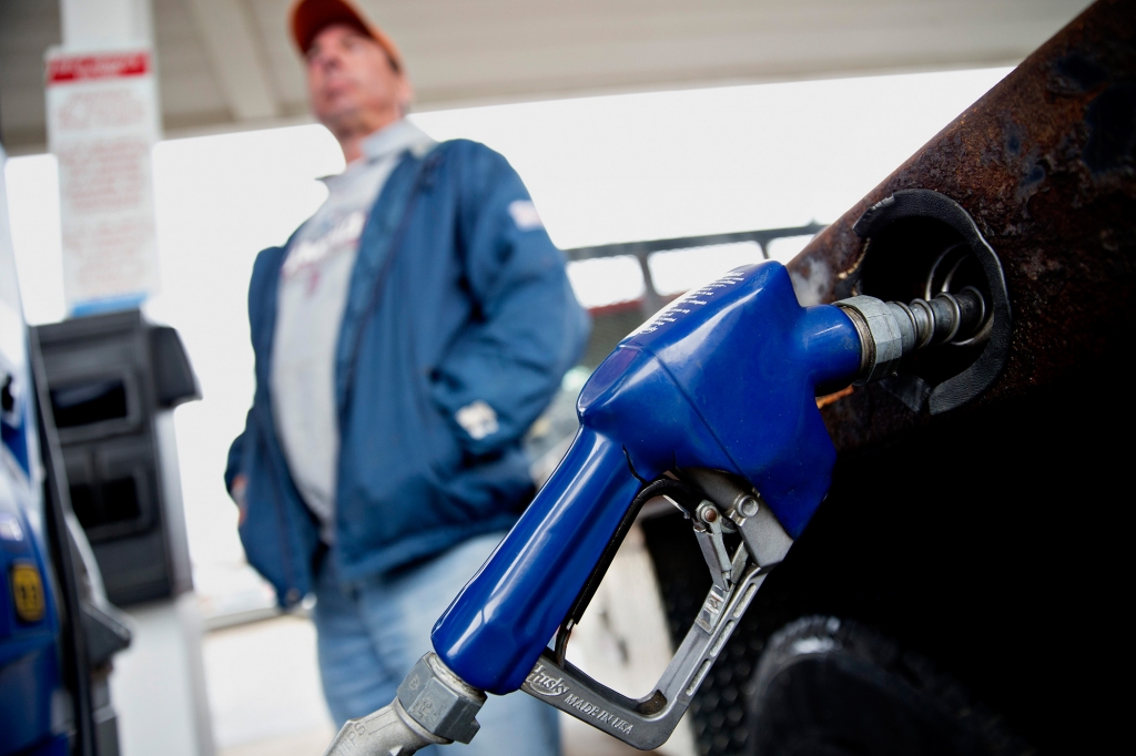 A customer fills up a vehicle with fuel at an Exxon Mobil Corp. gas station in Rockford Illinois