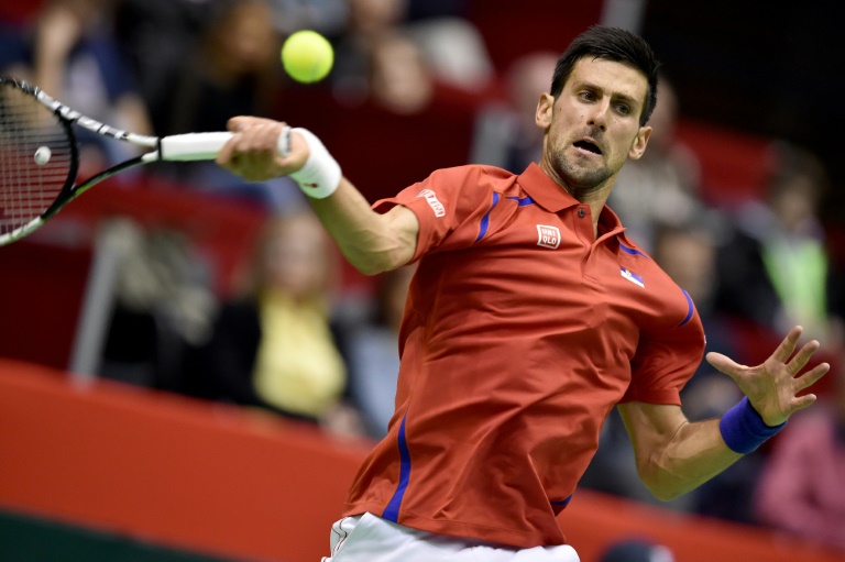 AFP  Andrej IsakovicSerbia's Novak Djokovic returns a shot to Kazakhstan's Aleksandr Nedovyesov during the Davis Cup World Group first round single match between Serbia and Kazakhstan at the Aleksandar Nikolic hall in Belgrade