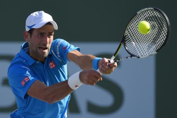 Novak Djokovic of Serbia returns to Jo Wilfried Tsonga