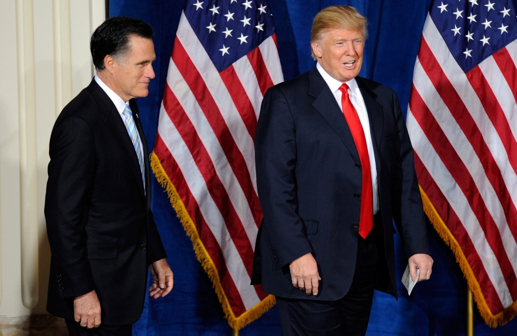 Former Massachusetts Gov. Mitt Romney and Donald Trump arrive at a news conference held by Trump to endorse Romney for president at the Trump International Hotel & Tower Las Vegas