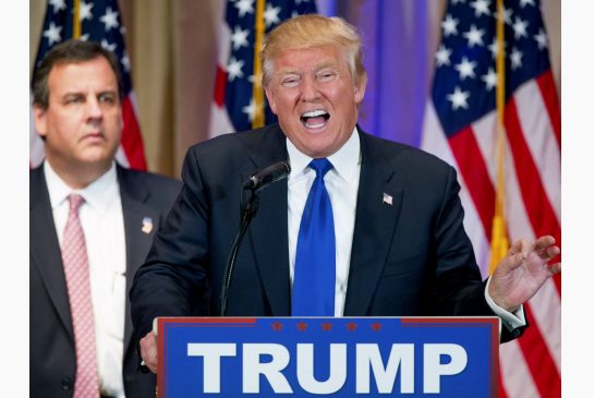 Republican presidential candidate Donald Trump accompanied by New Jersey Gov. Chris Christie left speaks during a news conference on Super Tuesday primary election night in Palm Beach Fla. Tuesday