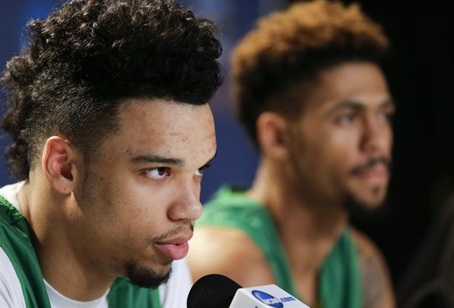 Oregon forward Dillon Brooks left speaks during a news conference alongside teammate guard Tyler Dorsey before an upcoming regional finals basketball game in the NCAA Tournament Friday