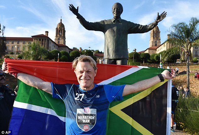 Comedian Eddie Izzard 54 finished his gruelling 27 marathon challenge under a giant statue of Nelson Mandela in Johannesburg South Africa today and described it as the'hardest thing he's ever done