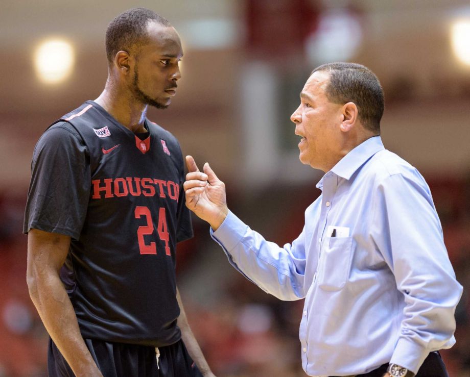 Houston Cougars Head Coach Kelvin Sampson gives instructions to Devonta Pollard during a time out in the second half against the Temple Owls in a college basketball game on Sunday