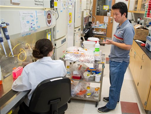 Feb. 29 2016 provided by Florida State University Professor Hengli Tang confers with his graduate student and co-author Sarah Ogden about the next steps in their Zika virus research in Tang�s lab at FSU in Tallahassee