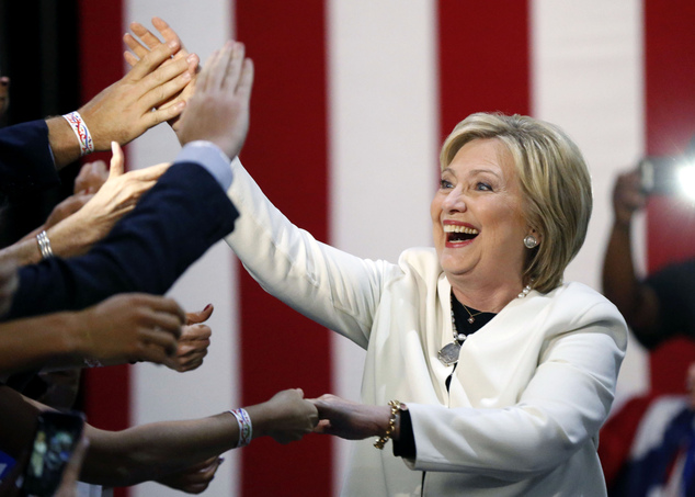 Democratic presidential candidate Hillary Clinton reacts to supporters as she arrives to address supporters at her Super Tuesday election night rally in Miam