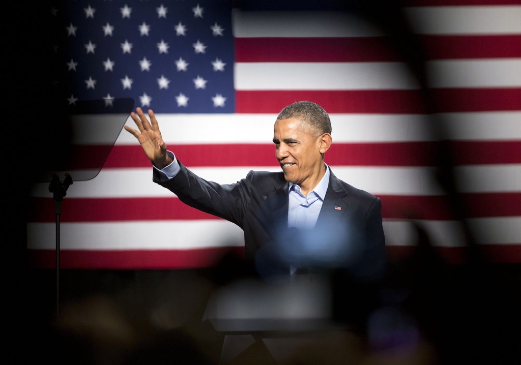 President Barack Obama waves to supporters before speaking at a Democratic National Committee fundraiser at Gilley