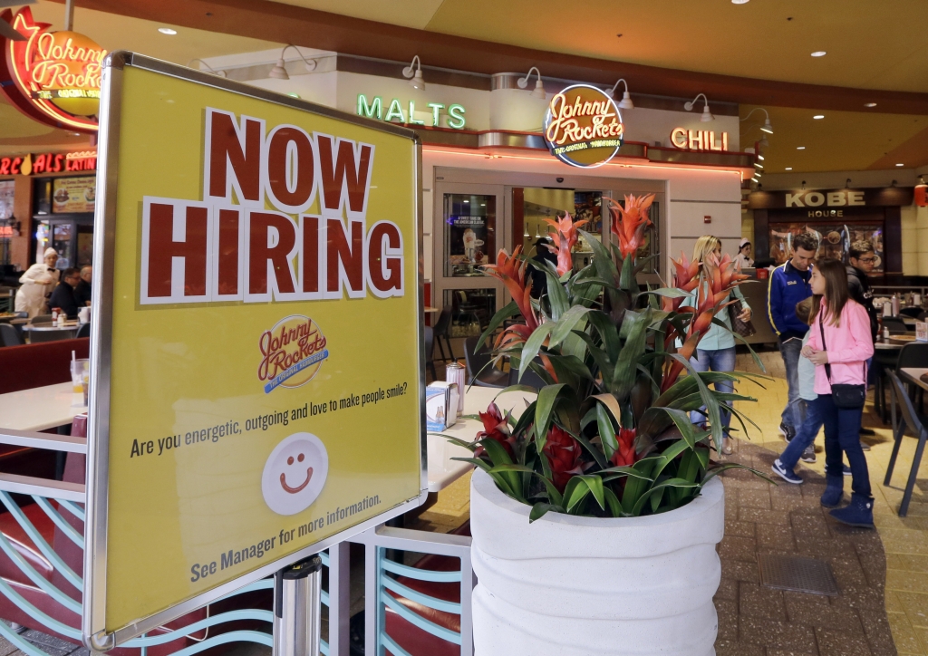 FILE – A restaurant seeks job hunters in Miami. Florida added slightly more jobs than Texas in January