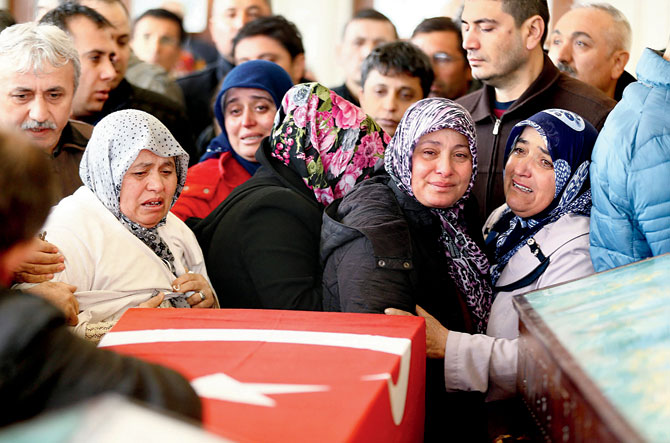 Family members and relatives of a victim mourn in a mosque in Turkey