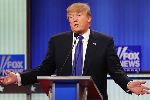 Republican presidential candidate Donald Trump defends himself in a debate sponsored at Fox Theatre