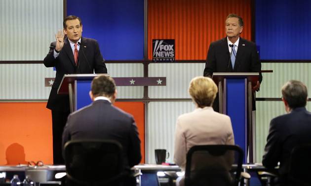 Republican presidential candidate Sen. Ted Cruz R-Texas argues a point as Ohio Gov. John Kasich listens during a Republican presidential primary debate at Fox Theatre Thursday