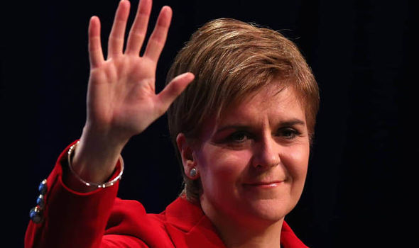 Nicola Sturgeon waving to the crowd