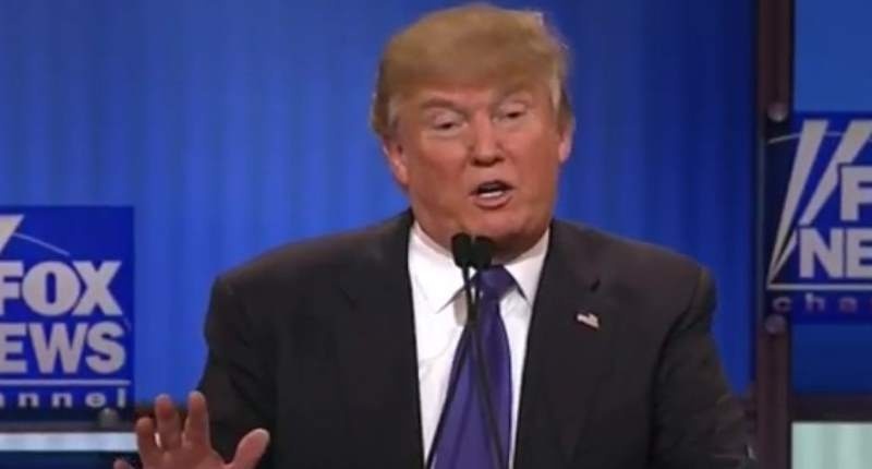 Donald Trump takes part in a Republican presidential candidate debate in Detroit