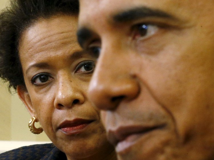 US Attorney General Loretta Lynch looks toward US President Barack Obama during their meeting in the Oval Office of the White House in Washington in this