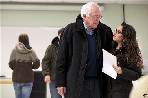 Democratic presidential candidate Sen. Bernie Sanders is hugged by a voter after voting in the Vermont primary in Burlington Vermont Tuesday