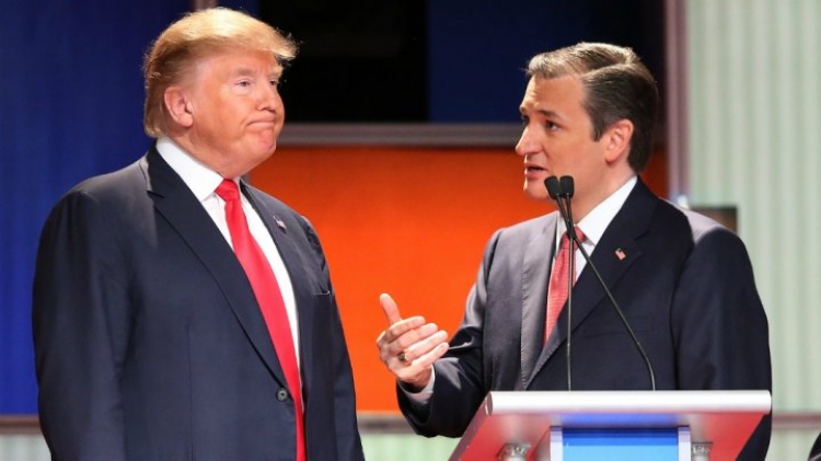 Donald Trump and Ted Cruz discuss during a televised debate in South Carolina