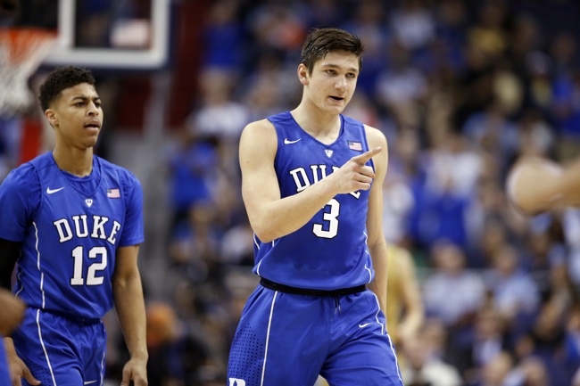 Duke guard Derryck Thornton and Duke guard Grayson Allen react as they walk to the bench for a time out during the first half of an NCAA college basketball game in the Atlantic Coast Conference tournament against Notre Dame Thursday