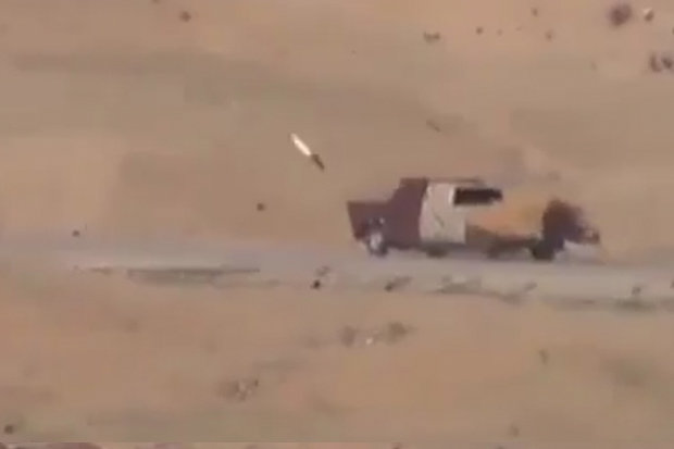 INCOMING The missile hurtles towards the car bomb