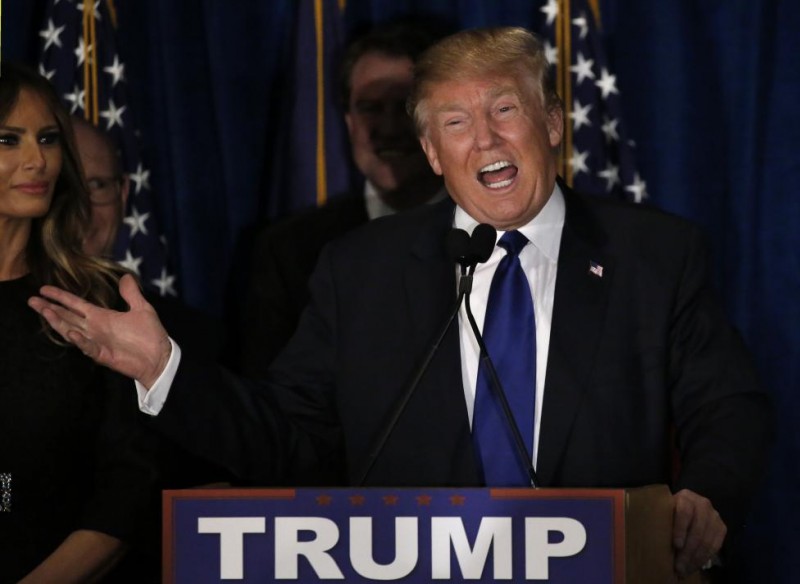 Republican U.S. presidential candidate Donald Trump reacts on stage during his victory speech at his 2016 New Hampshire presidential primary night rally in Manchester New Hampshire