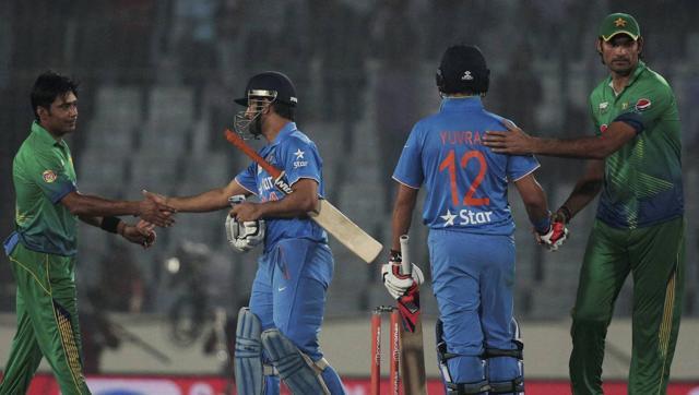 India’s captain Mahendra Dhoni greets Pakistan's Mohammad Sami during Asia Cup 2016