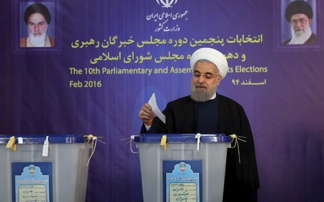 Iranian President Hassan Rouhani casts his vote during elections for the parliament and Assembly of Experts which has the power to appoint and dismiss the supreme leader in Tehran