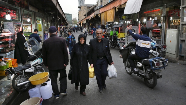 Iranians shop in a market in central Tehran Iran Sunday Feb. 28 2016