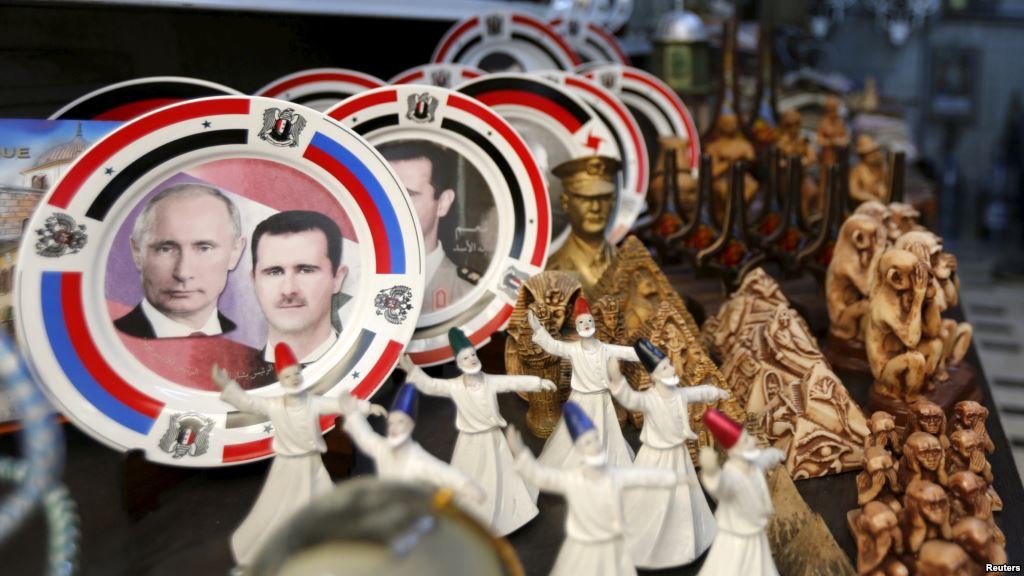 Souvenir plates depicting Syrian President Bashar al Assad and Russian President Vladimir Putin are seen among other items for sale in old Damascus. How closely the two are coordinating future plans is hard to guess however