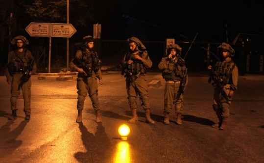 Israeli soldiers patrolling at Birzeit University on the outskirts of Ramallah in the West Bank during an operation