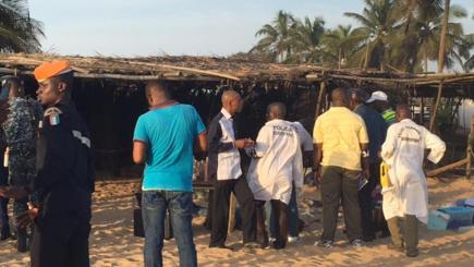 Security forces gather around the scene where gunmen attacked people in Grand Bassam Ivory Coast