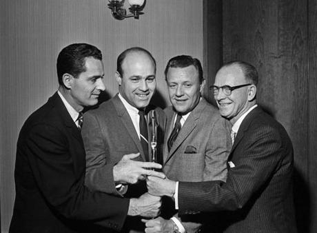 Mr. Garagiola jokingly jostled for the microphone at a news conference where he was introduced as part of the Yankees’ broadcast team. With him were Jerry Coleman Ralph Houk and legendary broadcaster Red Barber