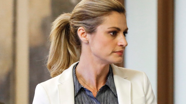 Sportscaster and television host Erin Andrews walks to the courtroom after a lunch break March 3 in Nashville. Andrews filed a $75 million lawsuit against the franchise owner and manager of a luxury hotel and a man who admitted to making secret nude recor