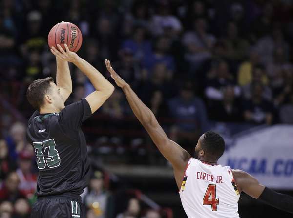 Hawaii forward Stefan Jankovic shoots against Maryland forward Robert Carter during the first half of a second-round men's college basketball game in the NCAA Tournament in Spokane Wash. Sunday