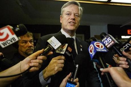 Charlie Baker spoke to reporters at the state house in Boston on Thursday