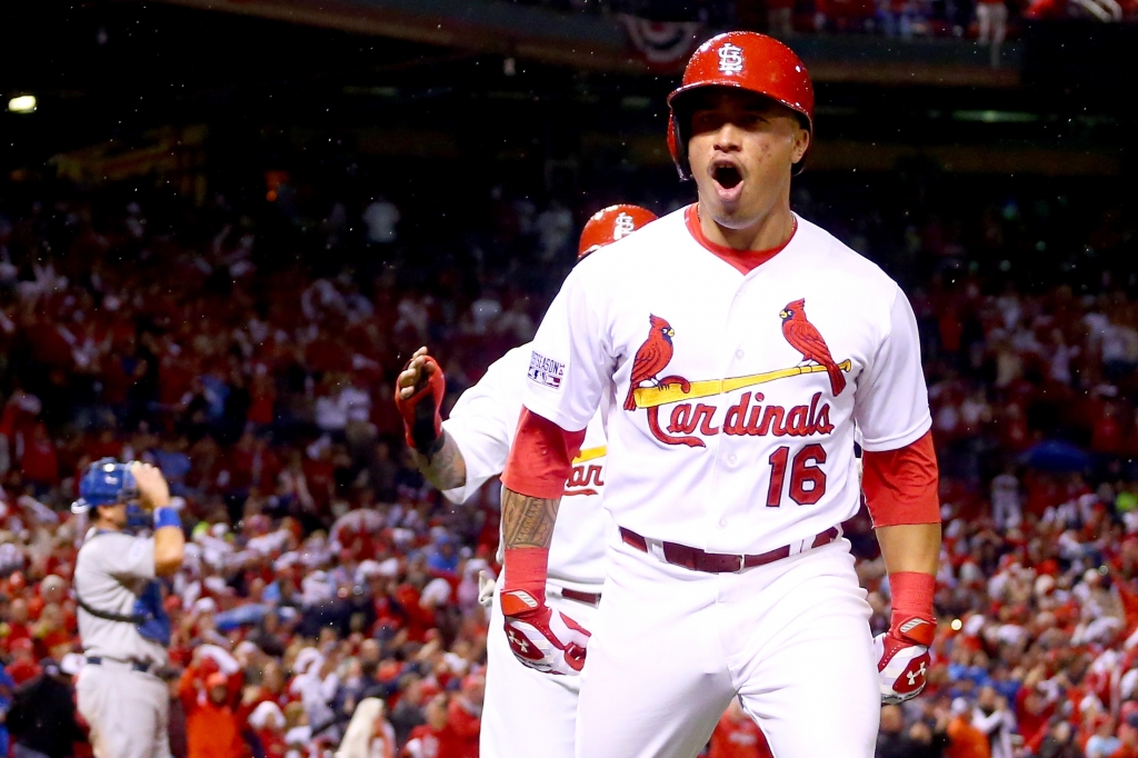 ST LOUIS MO- OCTOBER 06 Kolten Wong #16 of the St. Louis Cardinals reacts after he hits a two-run home run in the seventh inning against the Los Angeles Dodgers in Game Three of the National League Division Series at Busch Stadium