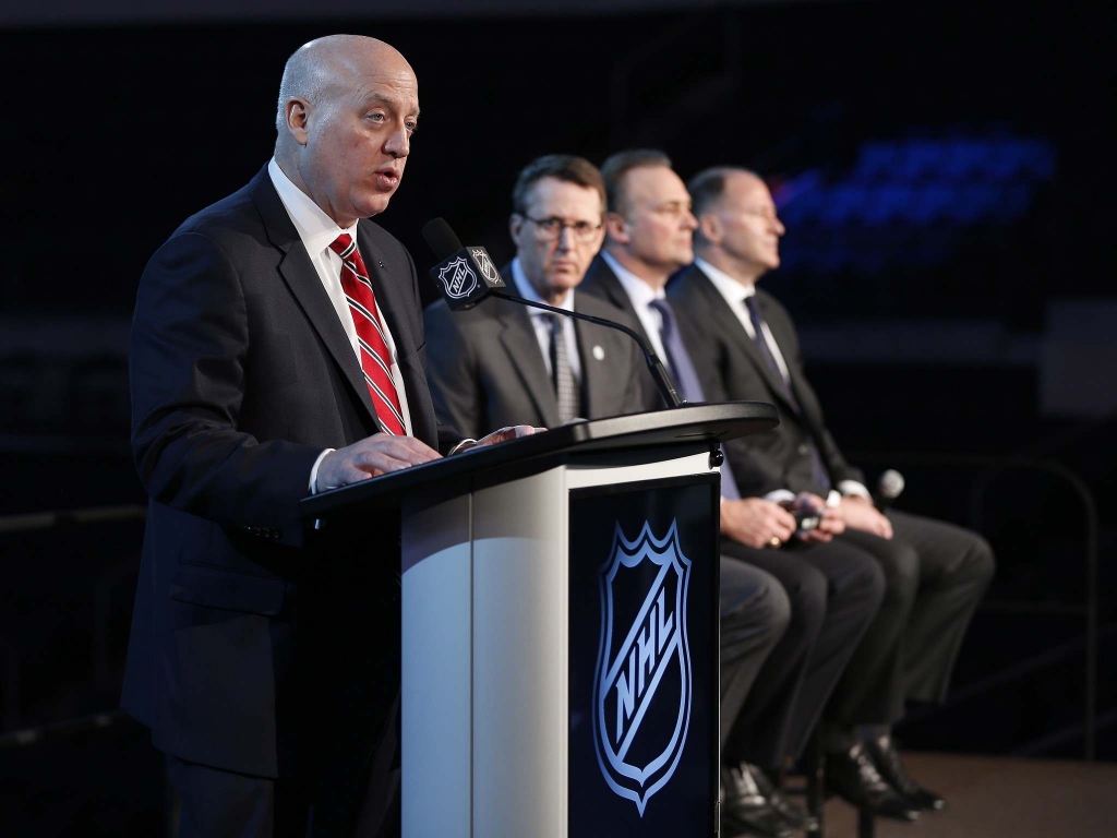 JOHN WOODS  THE CANADIAN PRESSNHL Deputy Commissioner Bill Daly announces the Heritage Classic between the Winnipeg Jets and the Edmonton Oilers to be played Oct. 23 in Winnipeg. Jets Chairman Mark Chipman Hockey Hall of Fame member Dale Hawerchuk and O