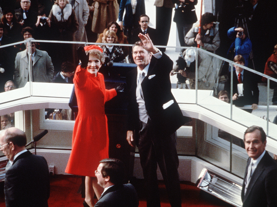 U.S. President Ronald Reagan waves beside his wife Nancy Reagan after being sworn in as 40th President of the United States