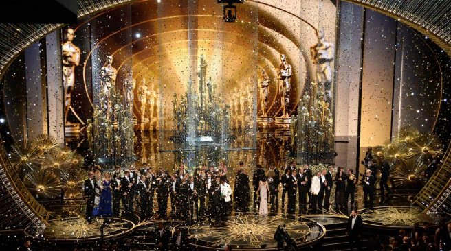 Confetti drops as Oscar winners celebrate onstage during the 88th Annual Academy Awards at the Dolby Theatre