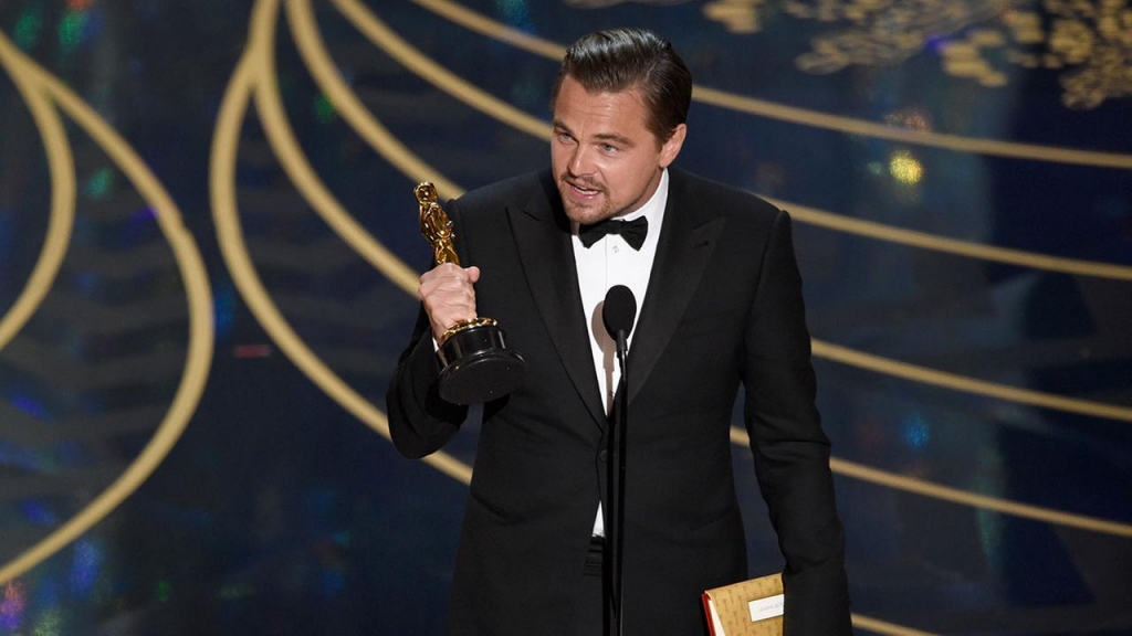 Leonardo Di Caprio accepts his first Oscar on Sunday night