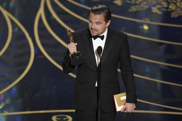 Leonardo Di Caprio accepts the award for best lead actor for “The Revenant” at the Oscars on Sunday at the Dolby Theatre in Los Angeles