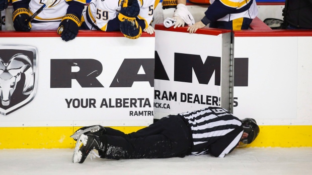 Linesman Don Henderson was hit by Calgary Flames&#39 Dennis Wideman during the second period of a game in Calgary on Jan. 27