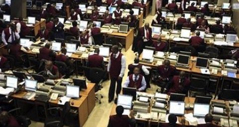 Brokers work on the trading floor of the Nigerian stock exchange in the commercial capital Lagos