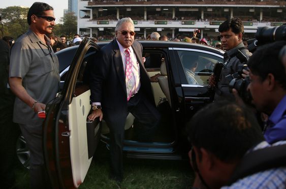 Indian businessman Vijay Mallya arrives for the Indian Derby 2015 at the Mahalaxmi race course in Mumbai India. India's government has been accused of'criminal conspiracy for allowing Formula One team boss