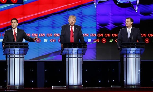 Republican presidential candidate Sen. Marco Rubio R-Fla. left speaks as Republican presidential candidates businessman Donald Trump and Republican presidential candidate Sen. Ted Cruz R-Texas listen during the Republican presidential debate spon