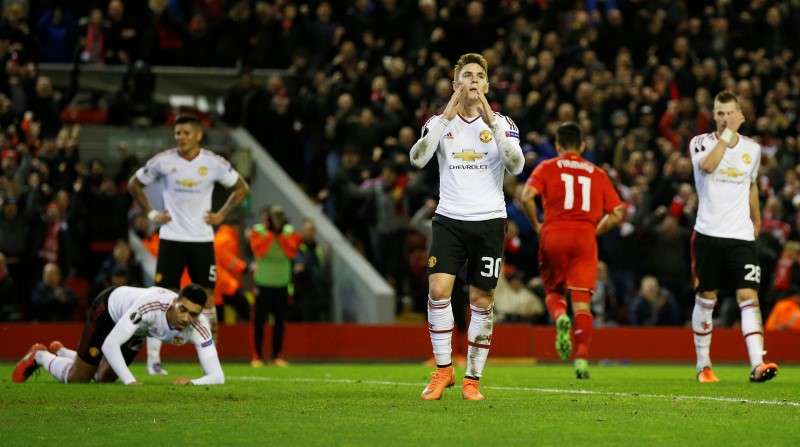 Football Soccer- Liverpool v Manchester United- UEFA Europa League Round of 16 First Leg- Anfield Liverpool England- 10/3/16 Manchester United's Gullermo Varela looks dejected with team mates after Roberto Firmino scored the second goal for Liverpoo