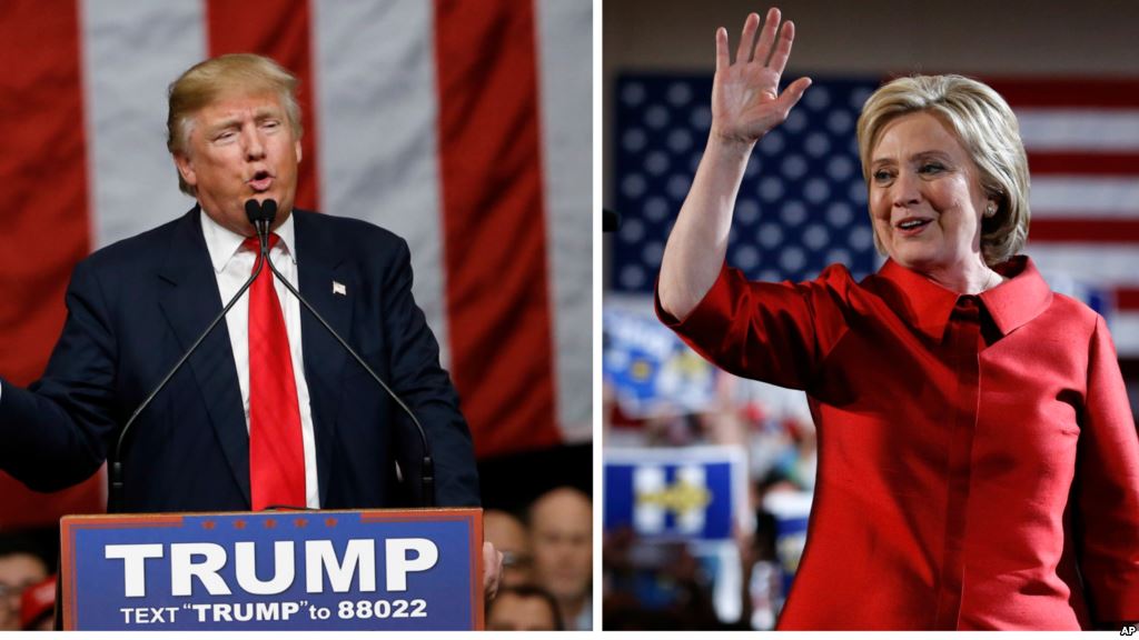 FILE- Republican presidential candidate Donald Trump and Democratic presidential candidate Hillary Clinton are seen acknowledging supporters in a Feb. 20 2016